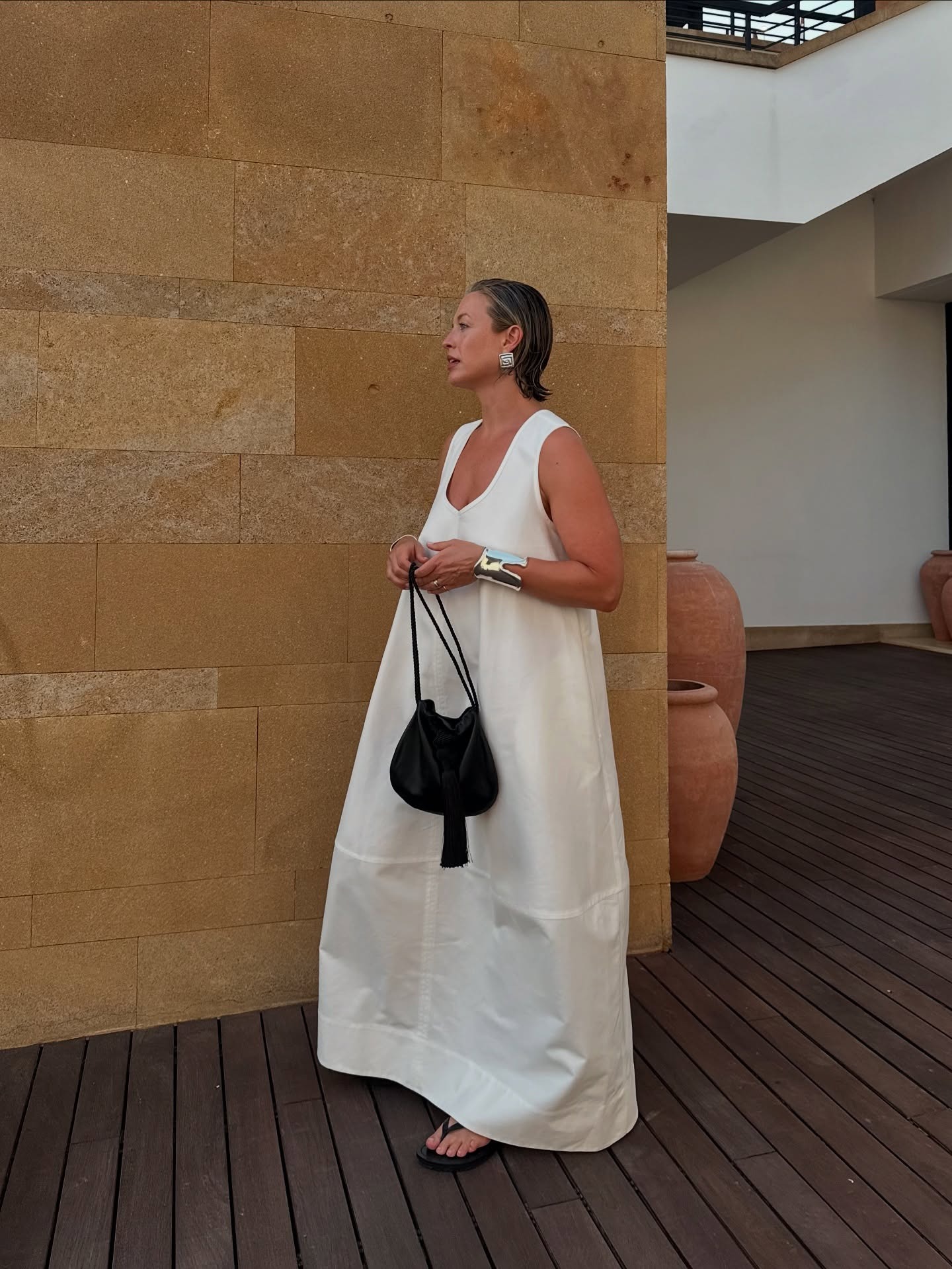 Alexis Foreman wears an all-white summer outfit.