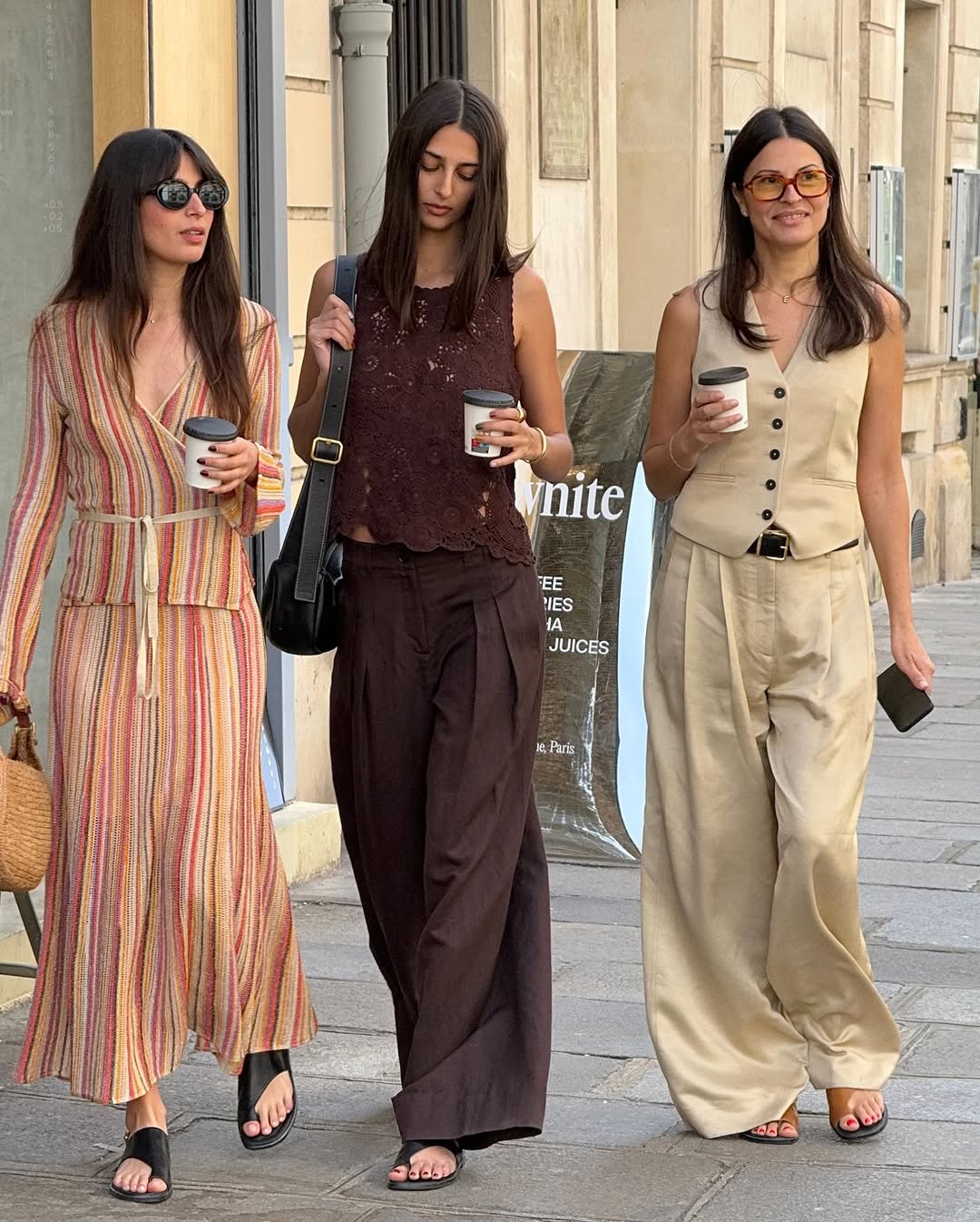 Salome Mory with Tamara Mory and Elisabeth Bento wearing brown trousers with a brown crochet top