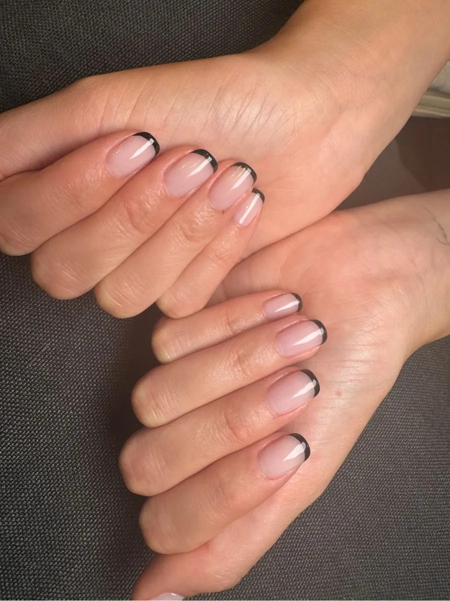 An image of Victoria Ceretti's black French tip manicure at the 2025 Met Gala.