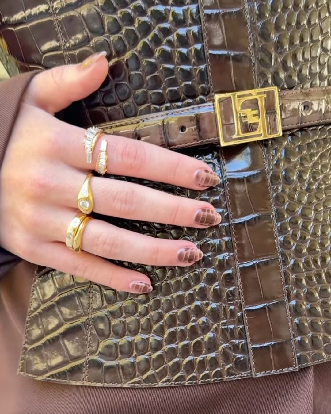 Screenshot of a video that nail artist Zola Ganzorigt posted to her Instagram of Sydney Sweeney's brown croc-print manicure.
