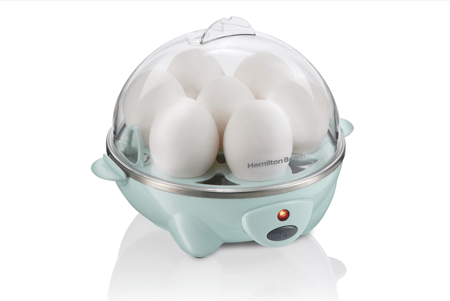 Egg cooker with see-through top and seven eggs inside.