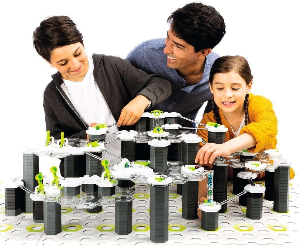 Man, woman, and child playing a board game.