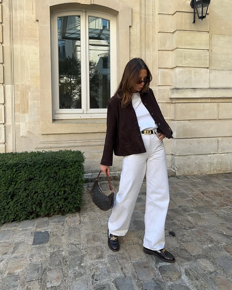 @clemdelacreeme wears a brown jacket and white jeans