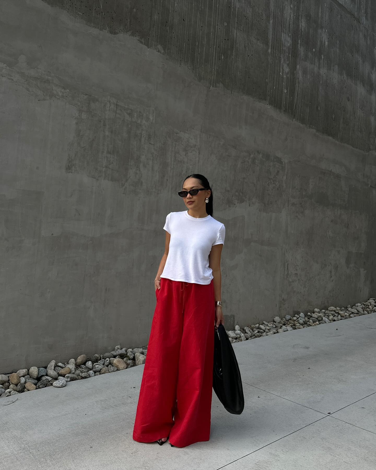 @dawn.tan wears a white T-shirt with red trousers