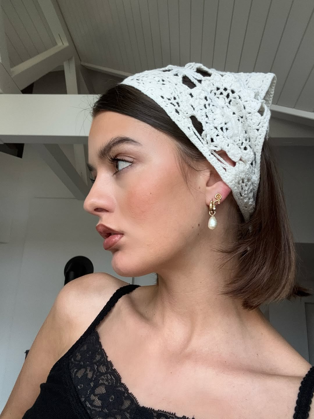 Mary L. Jean wears a white bandana over her trendy french bob