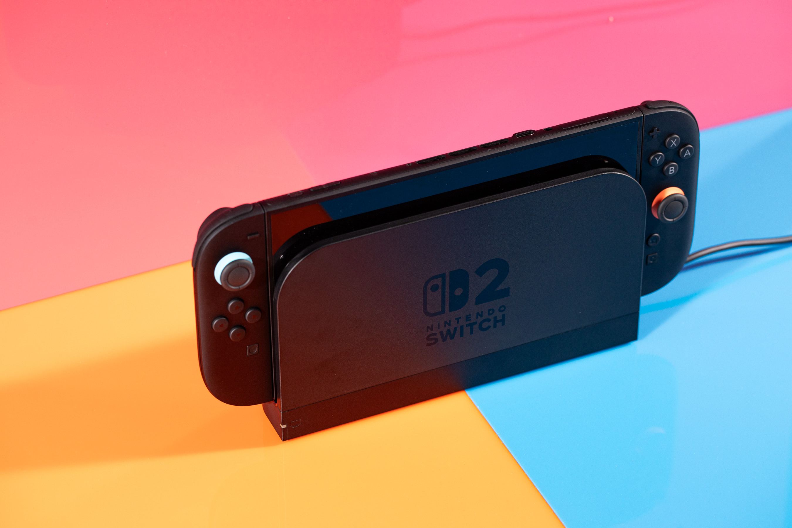 A photo of a Nintendo Switch 2 in its dock.