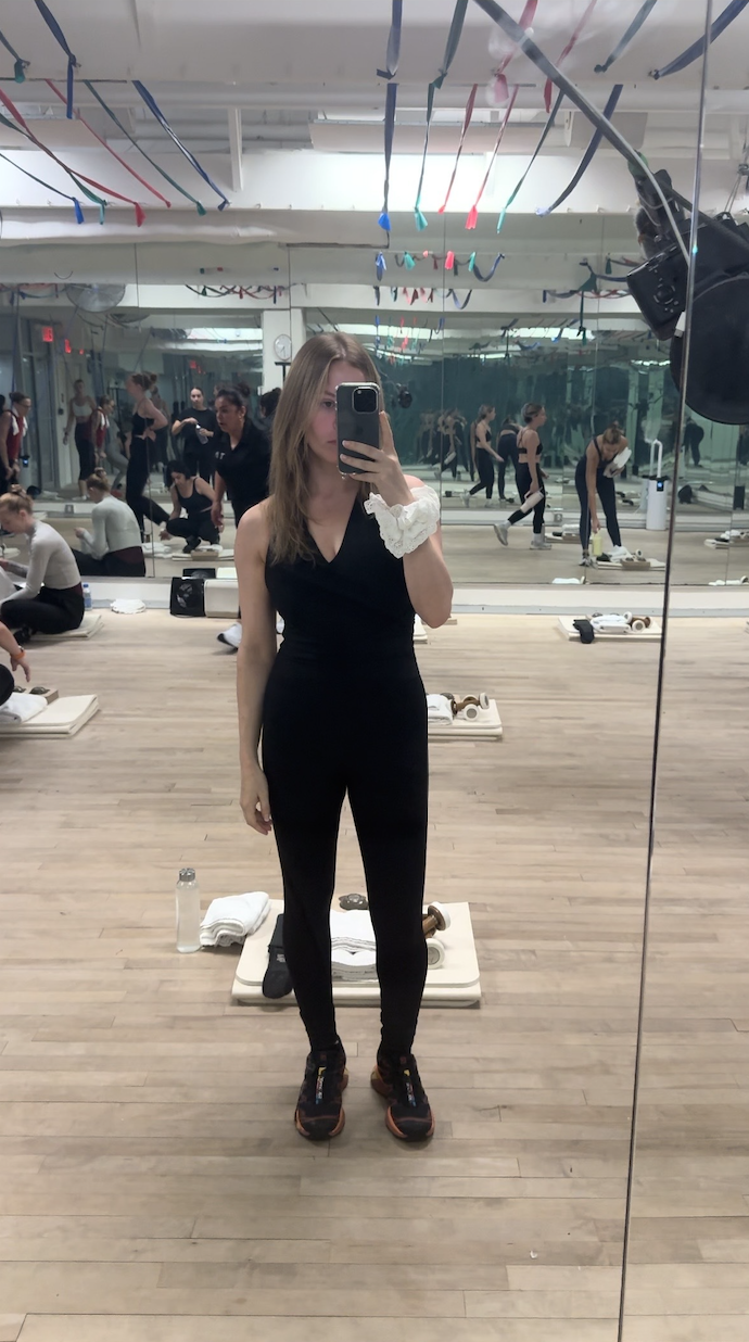 Nikki wears a onesie workout piece at Tracy Anderson.