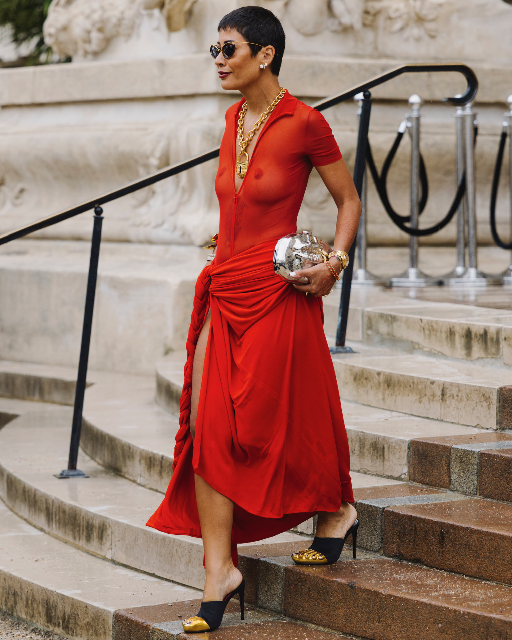 A guest wearing a Schiaparelli dress and shoes at the brand's FW25 Haute Couture show in Paris.