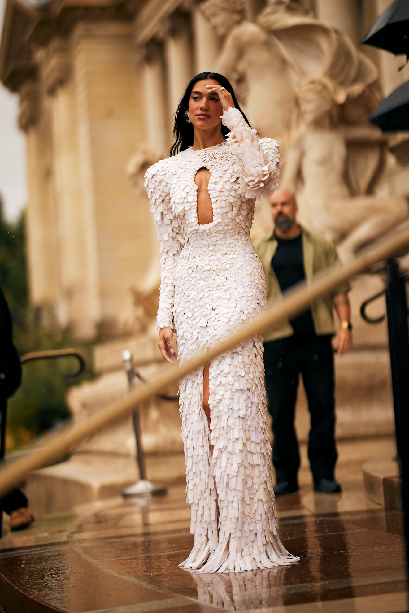 Dua Lipa wearing a Schiaparelli dress at the brand's FW25 Haute Couture show in Paris.