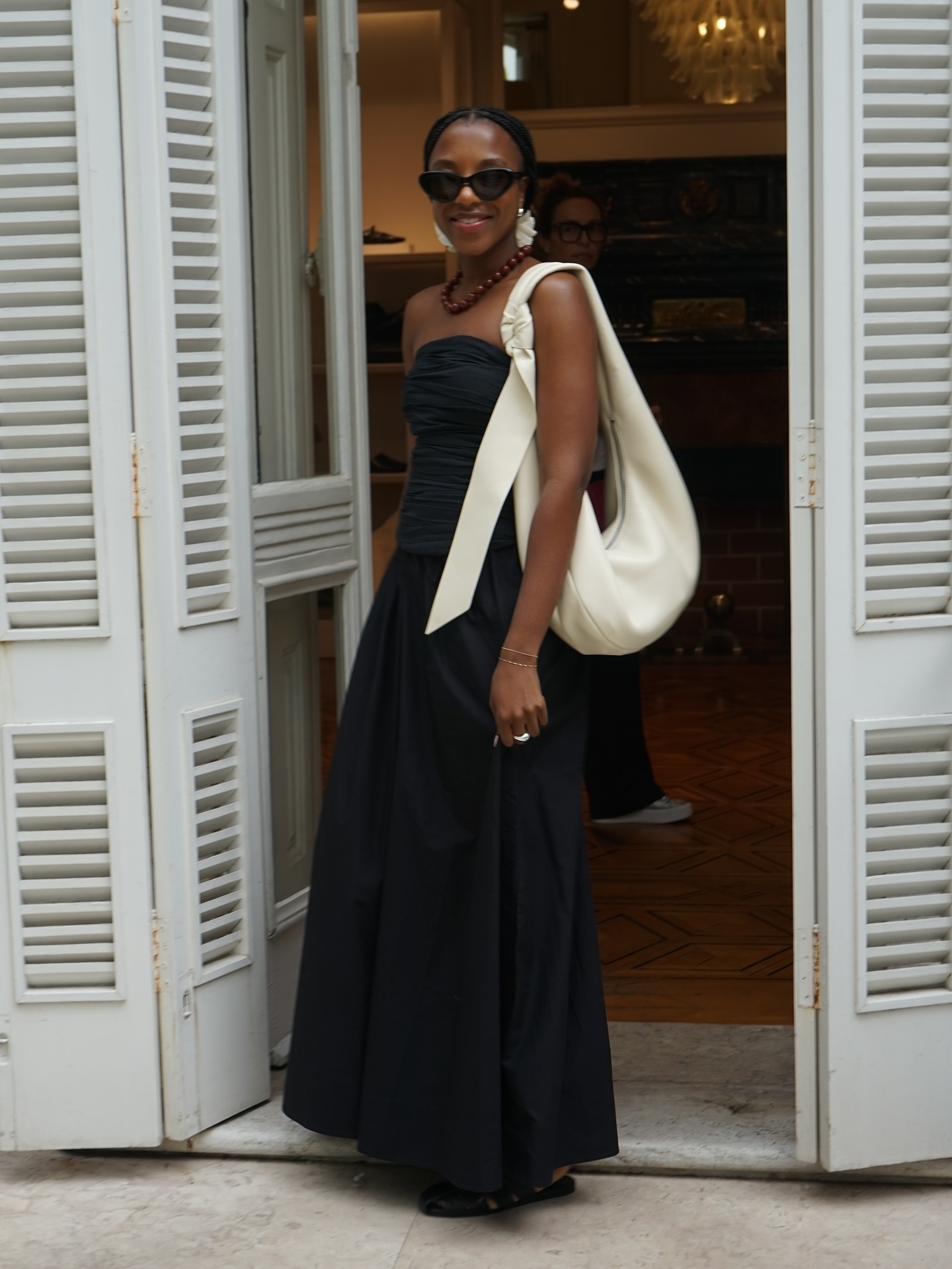 Taffy Msipa wears an all-black summer outfit.