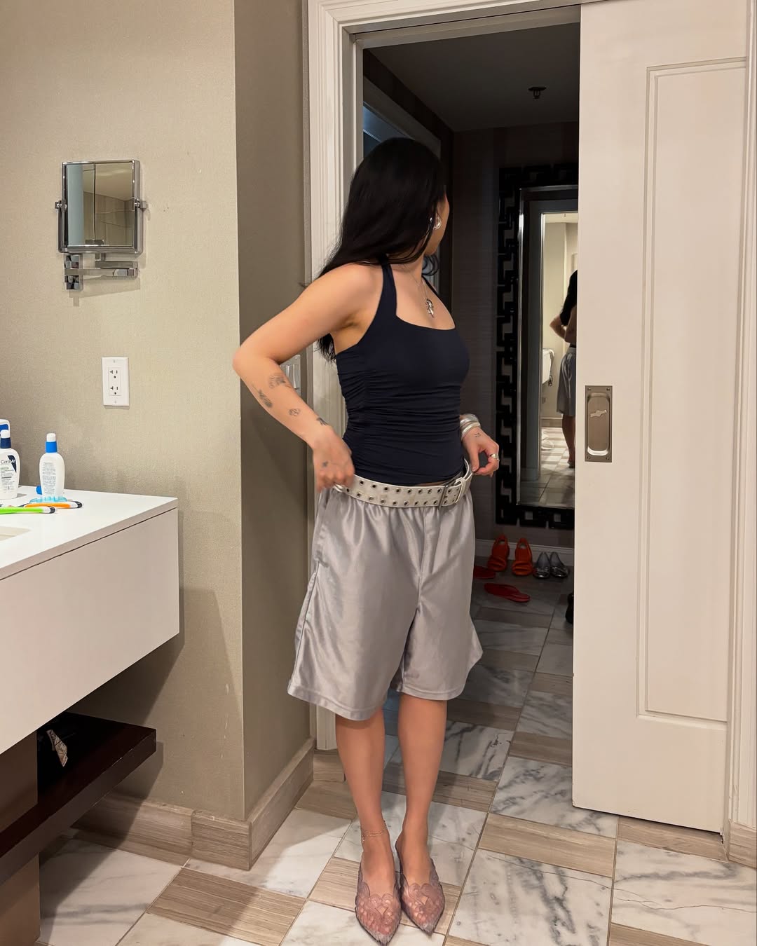 An influencer wearing clear heels.