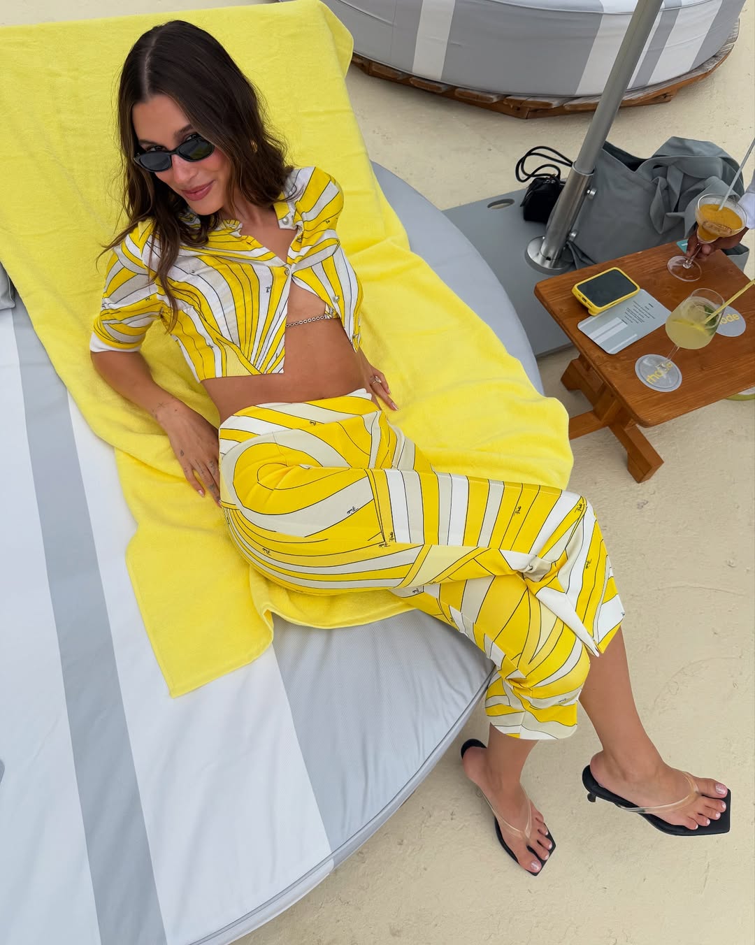 Hailey Bieber wearing clear heels.