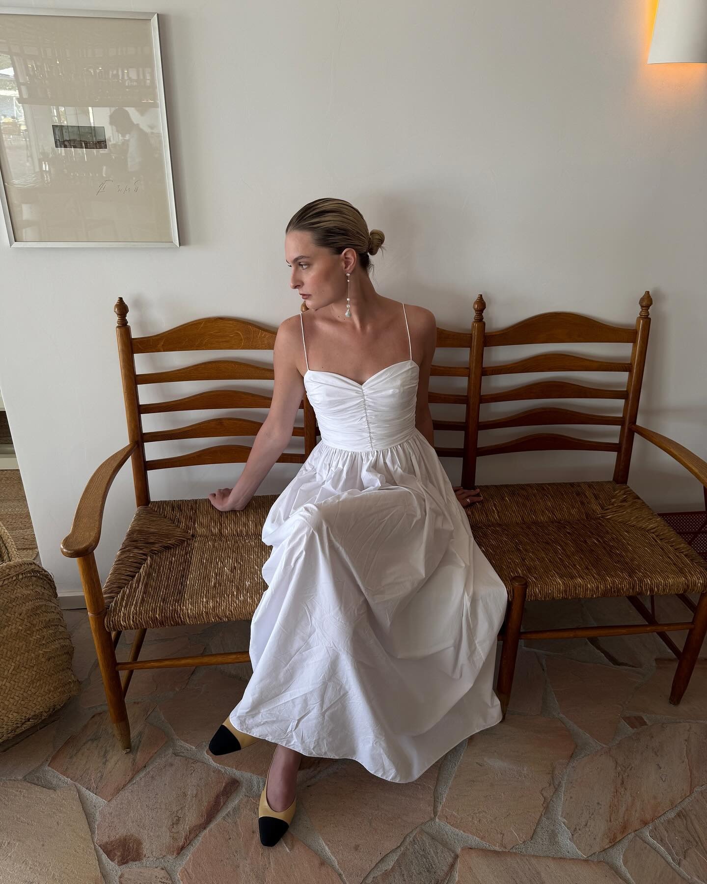 Influencer wearing a white cotton dress