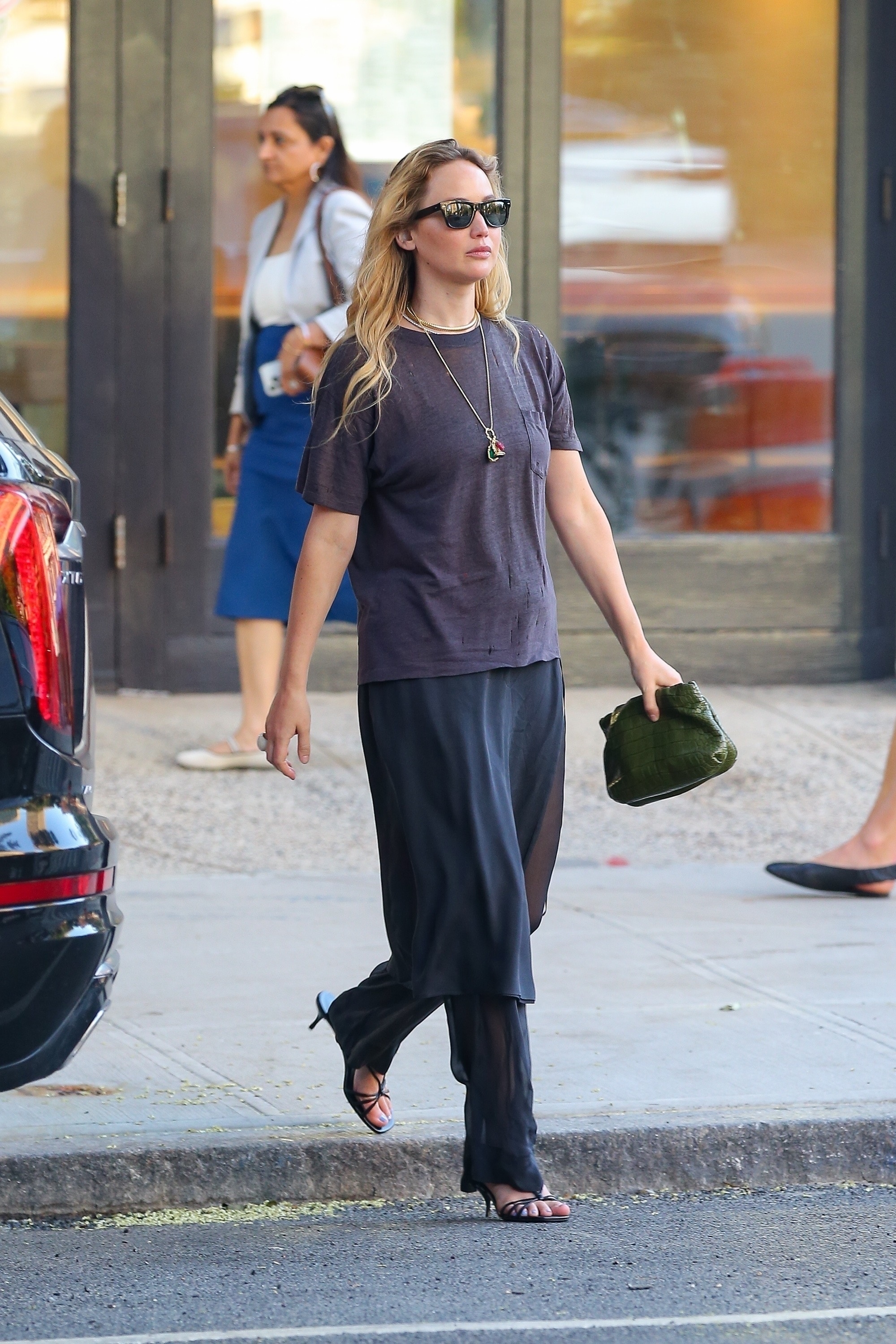 Jennifer Lawrence wearing a black T-shirt and black sunglasses in NYC