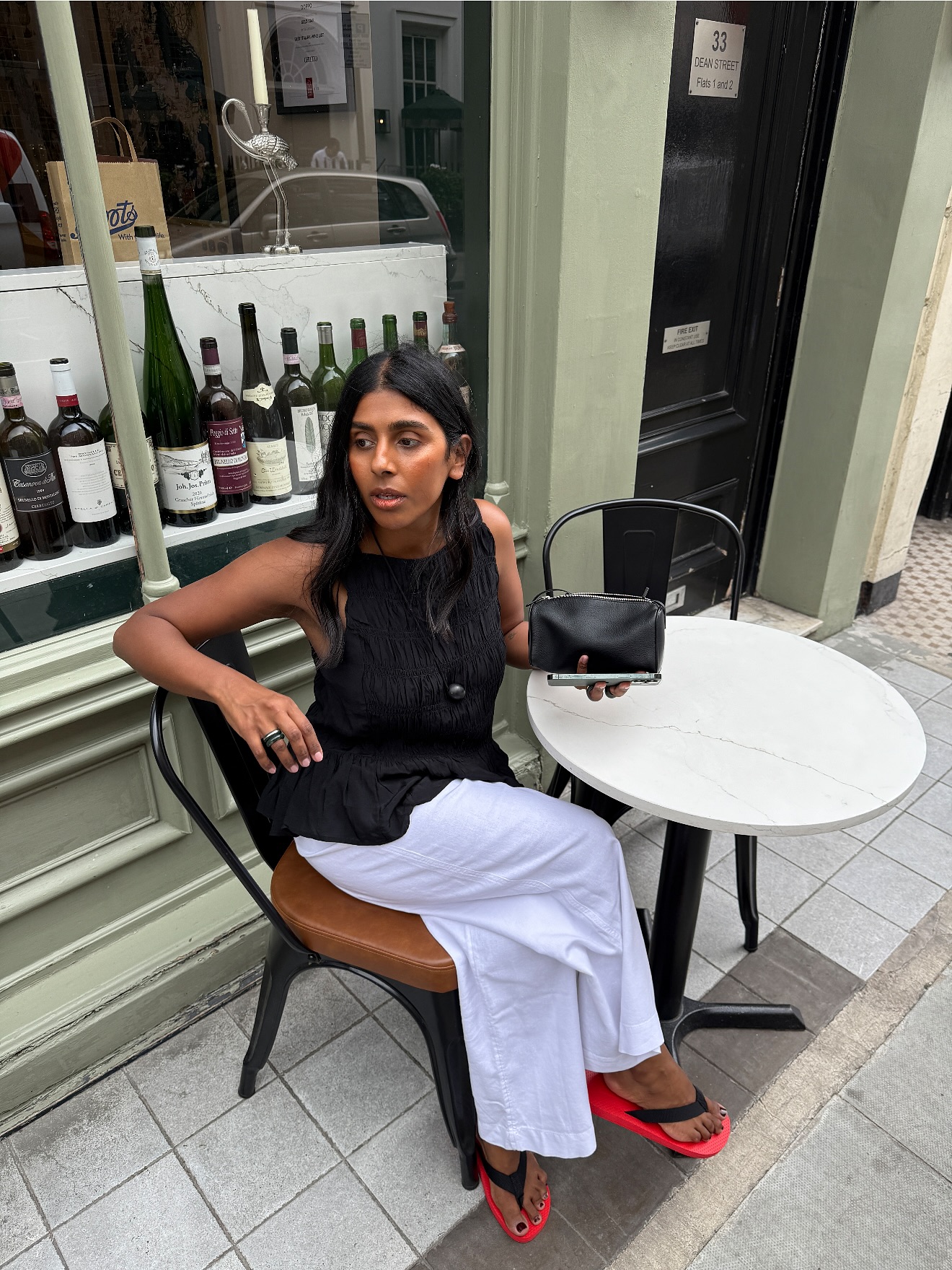 An image of @monikh wearing one of the key sleeveless top trends.