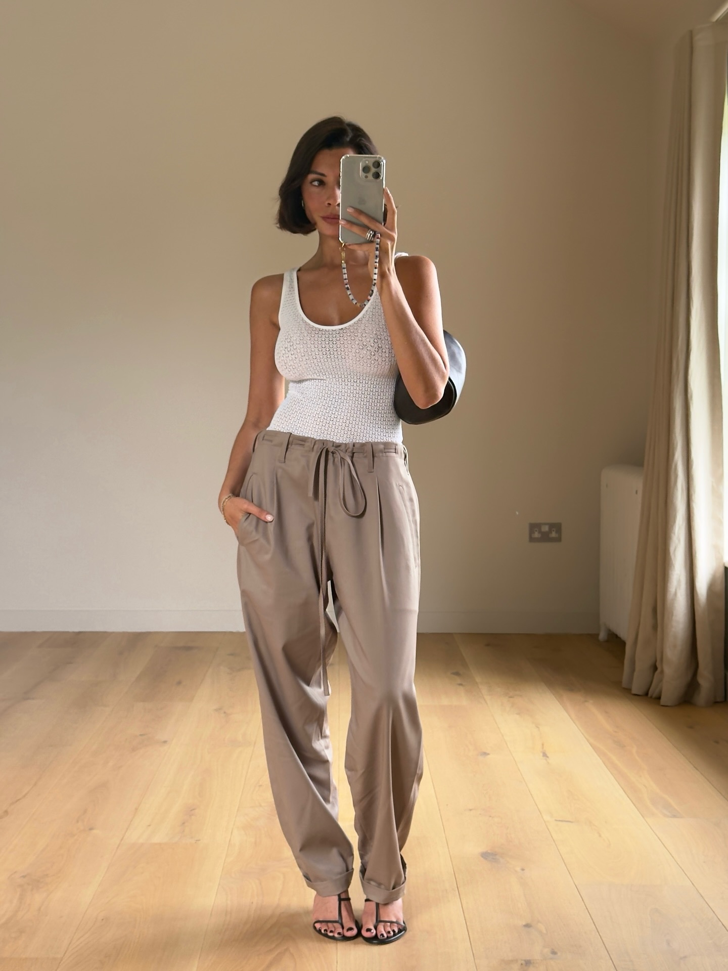 An image of @smythsisters wearing one of the key sleeveless top trends.