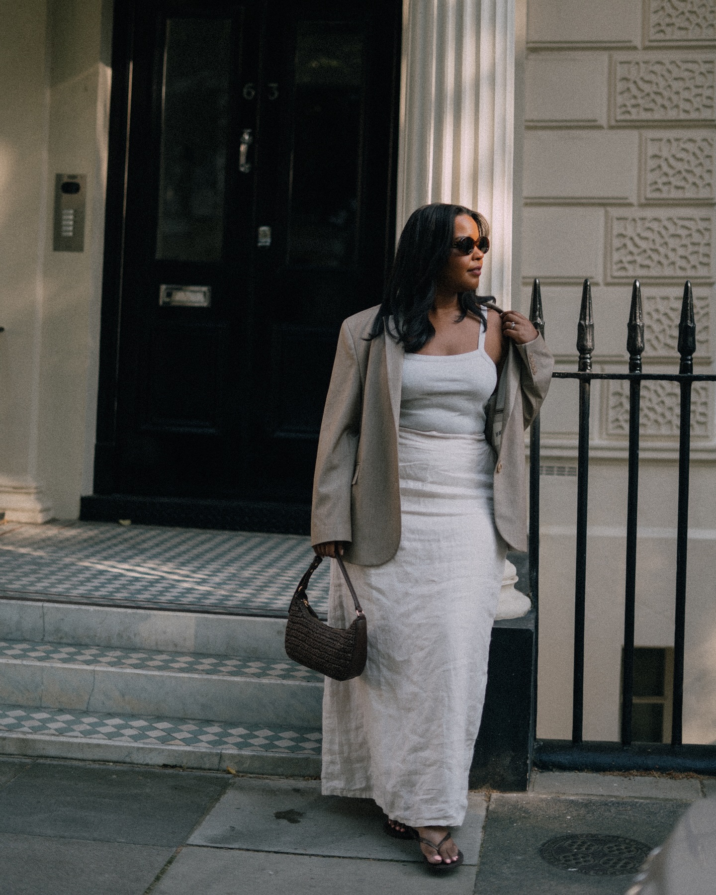 An image of @styleidealist wearing one of the key sleeveless top trends.