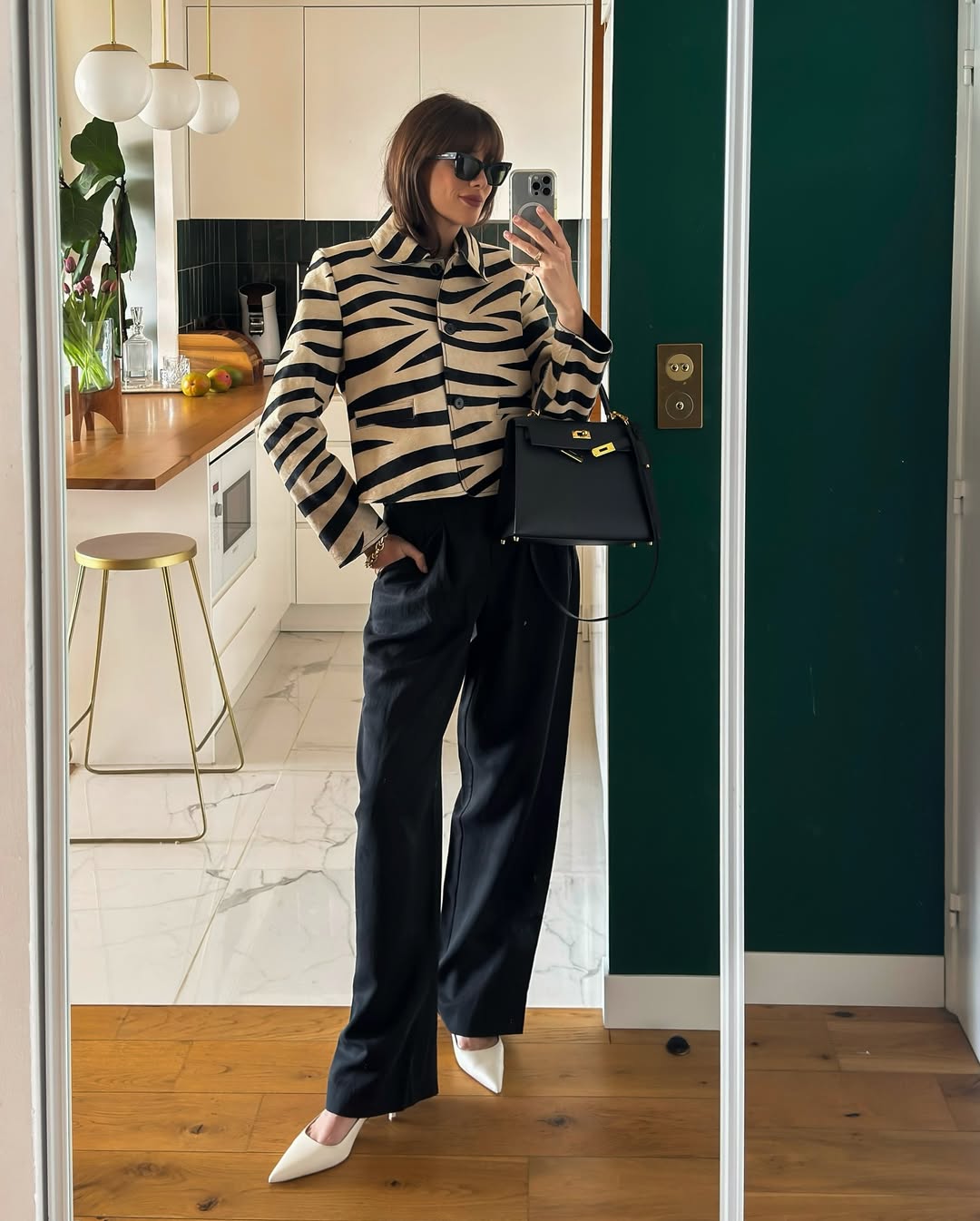 @juliesfi wearing animal print jacket and jeans