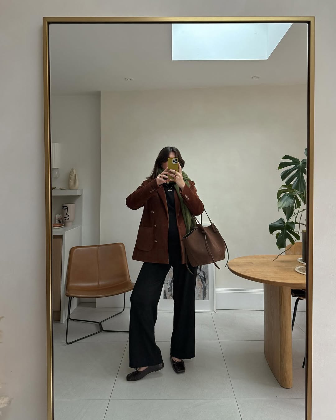 @francescasaffari wearing brown jacket and jeans