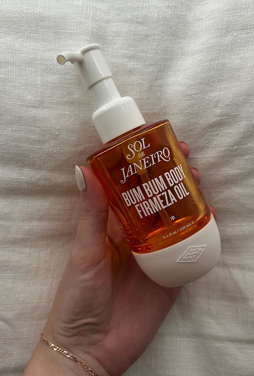 Sol De Janiero body oil on a linen surface