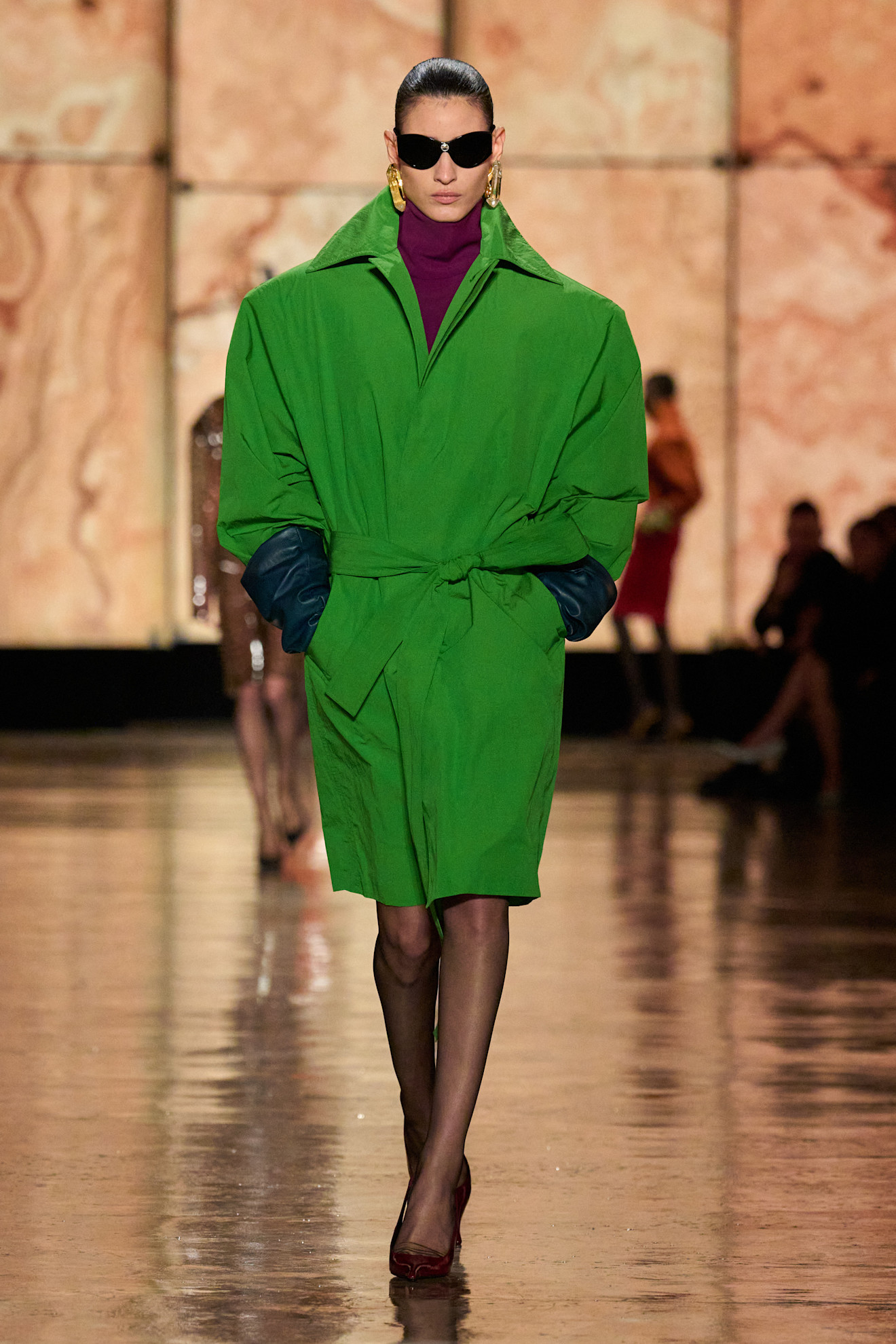 Model wears the dill green colour trend on the Saint Laurent autumn/winter 2025 runway.