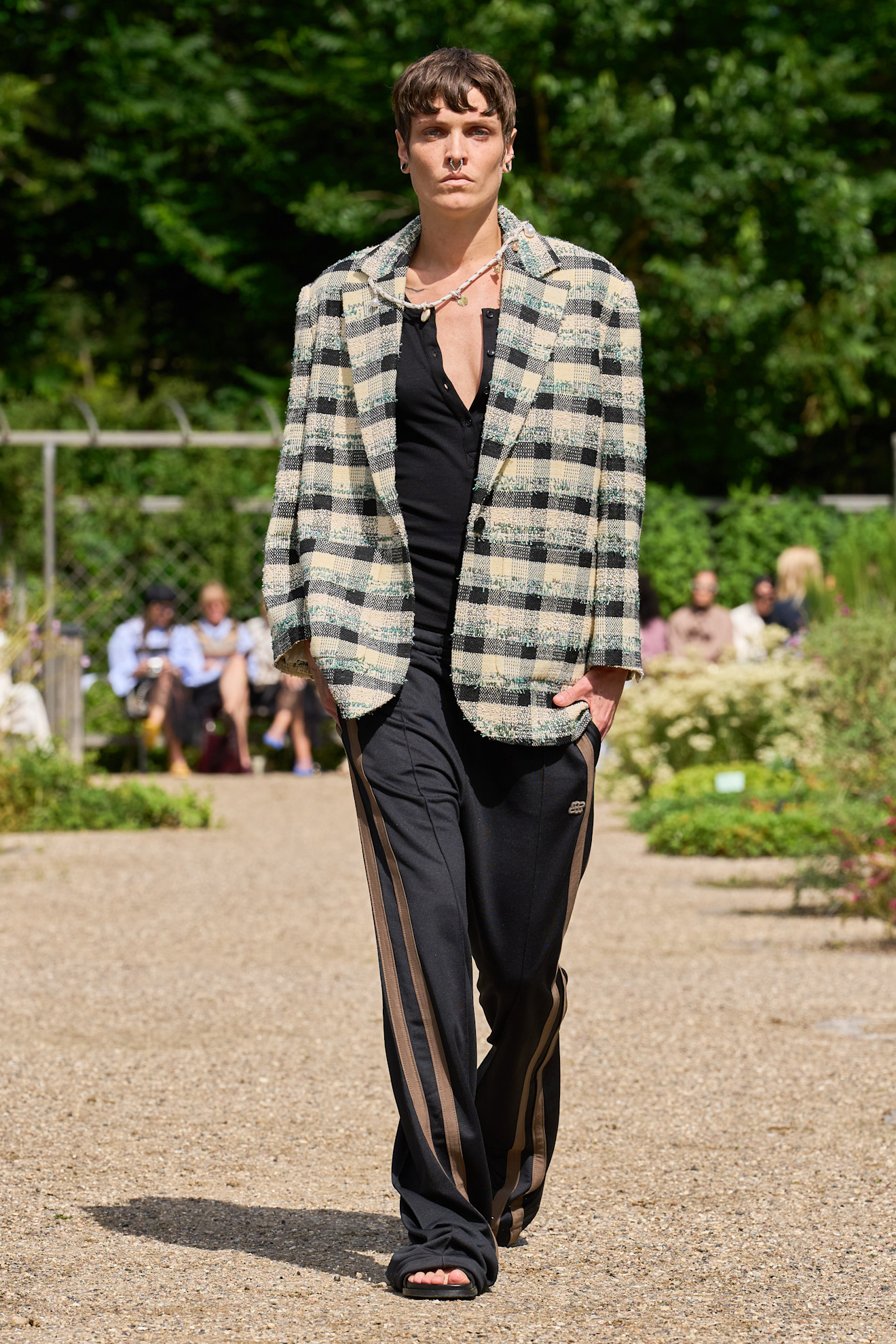 Model wears a check tartan print on the Munthe spring summer 2026 runway