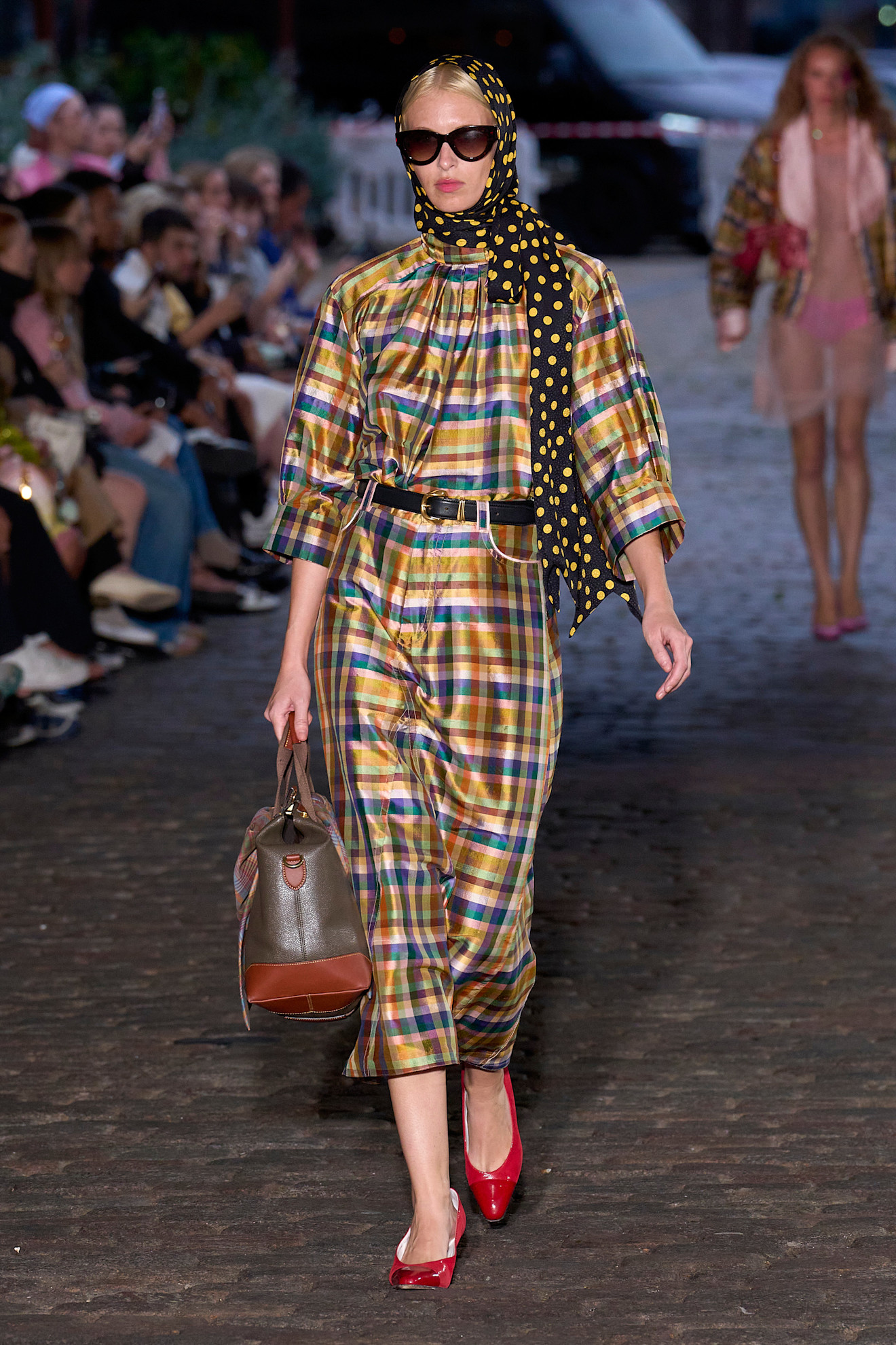 Model wears a check tartan print on the Caro Editions spring summer 2026 runway