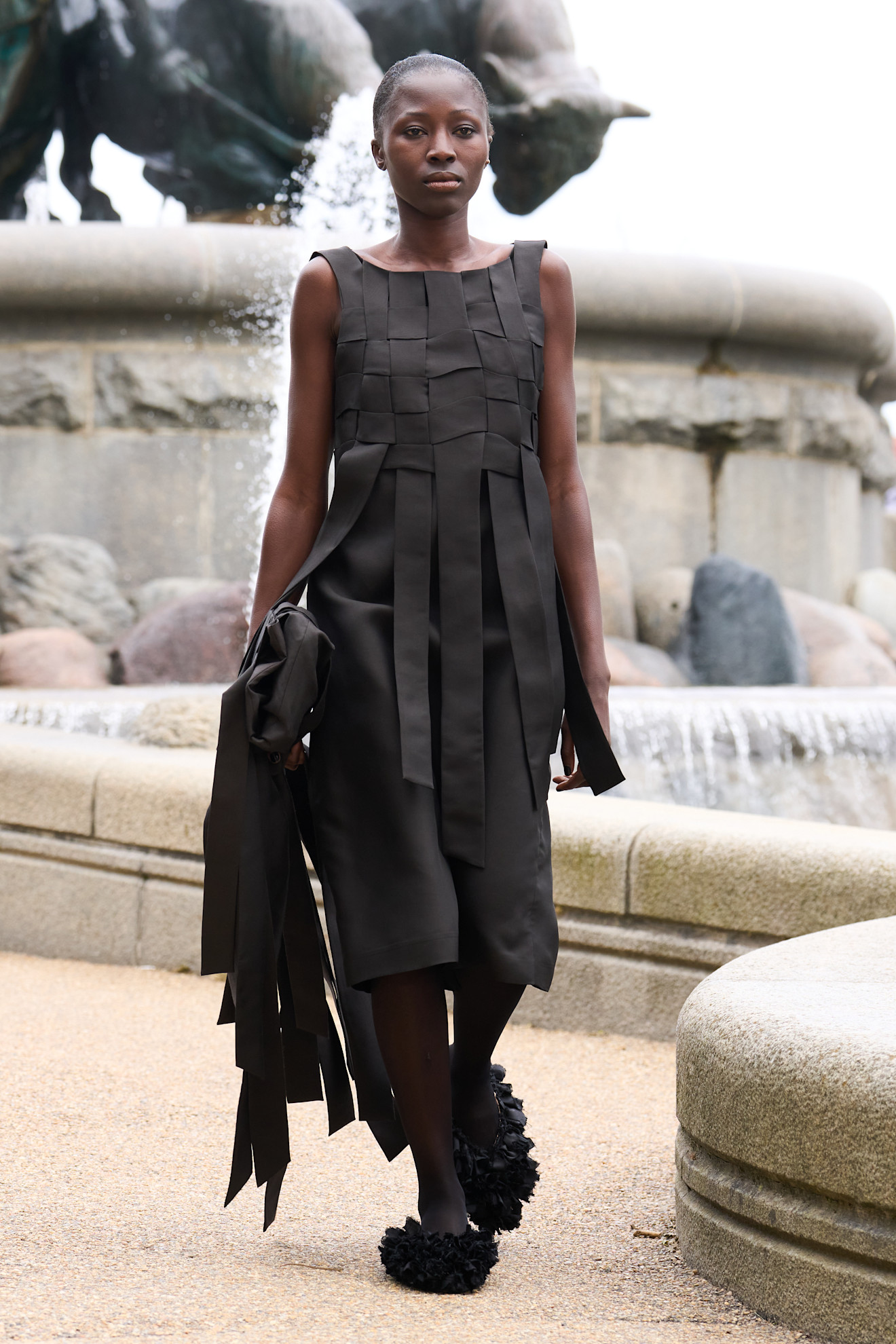 Model wears a woven garment on the MKDT spring summer 2026 runway.