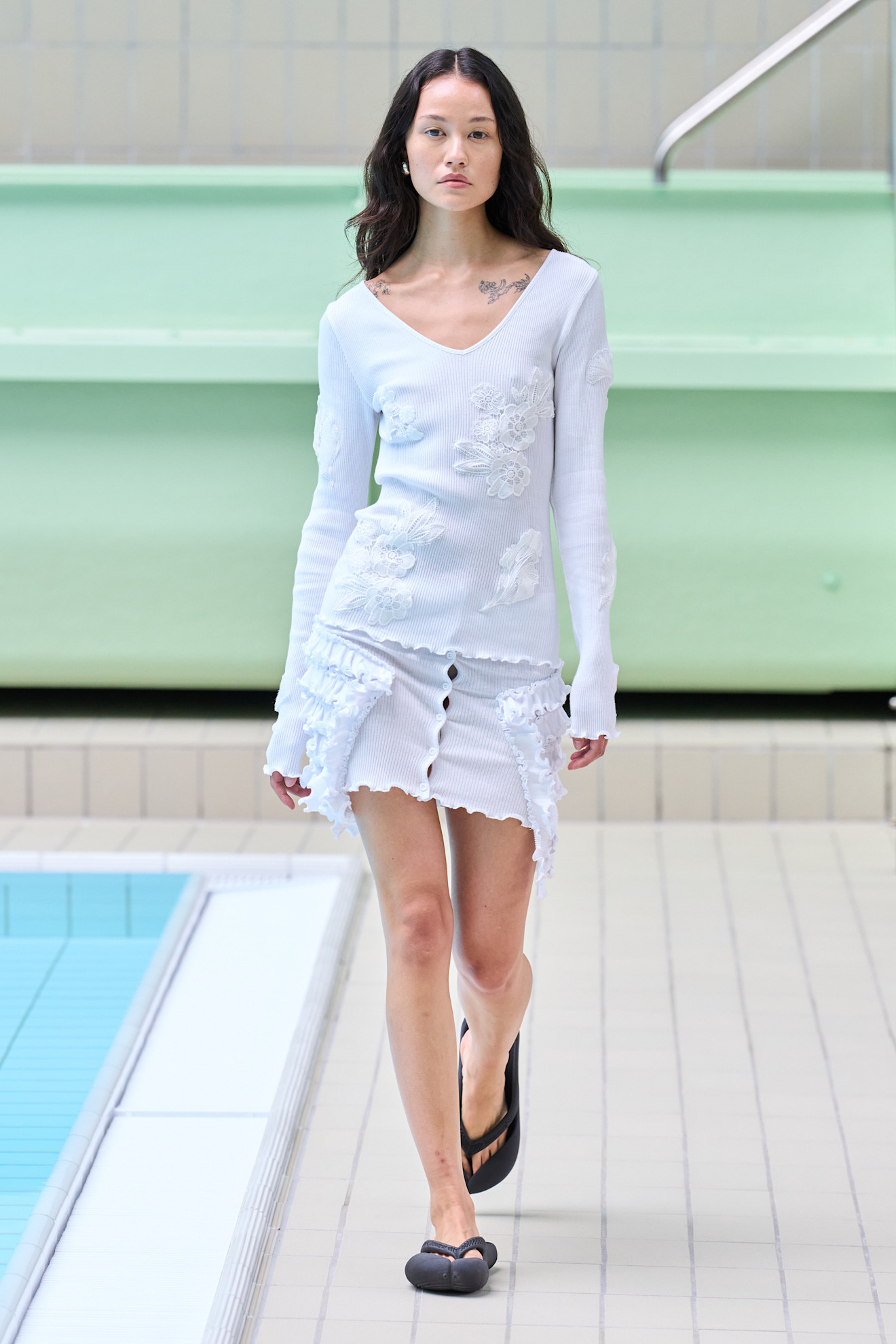 Model wears textured florals on the Opera Sport spring summer 2026 runway.