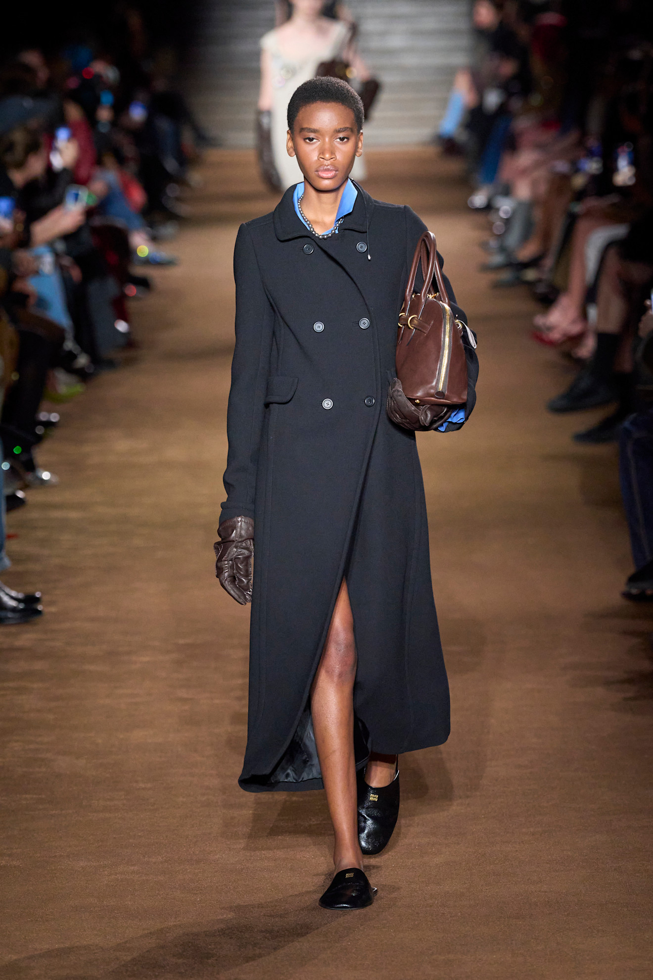 An image of slippers on Miu Miu's autumn/winter 2024 runway.