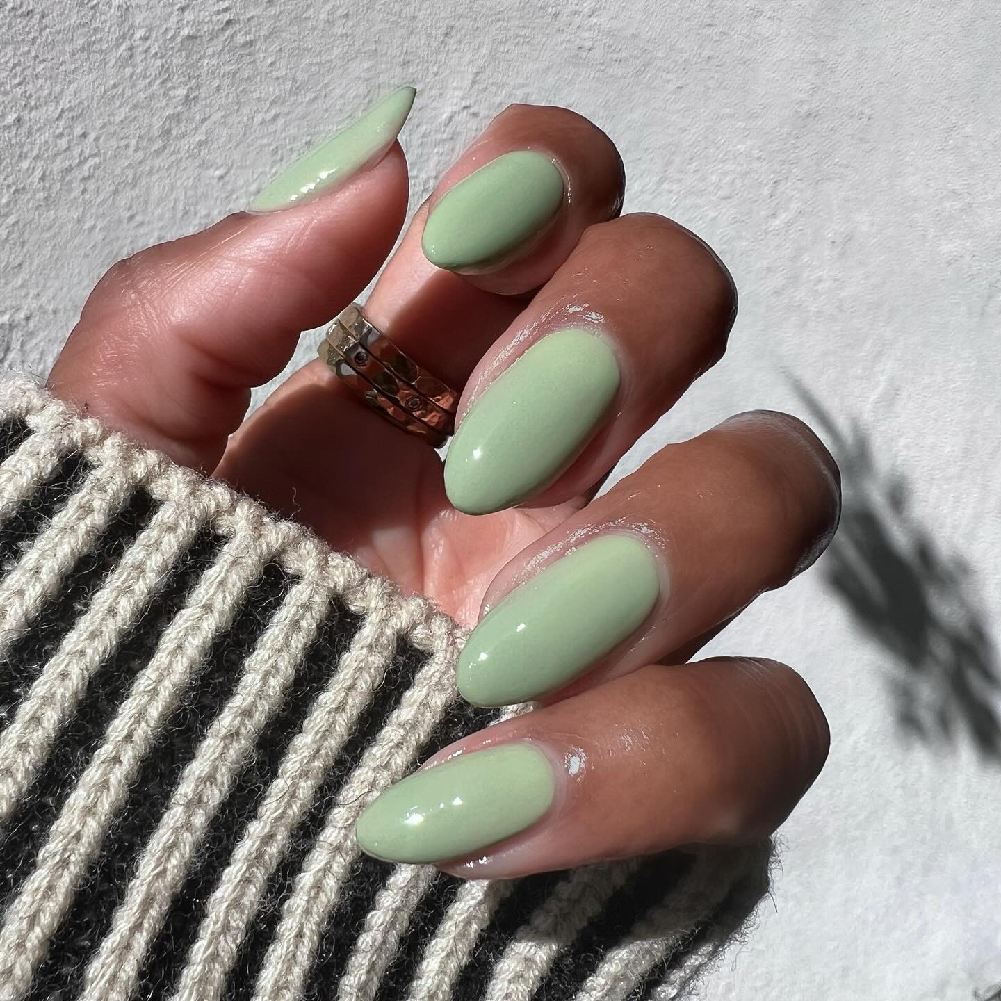 Photo of @themaniclub wearing sage nail polish