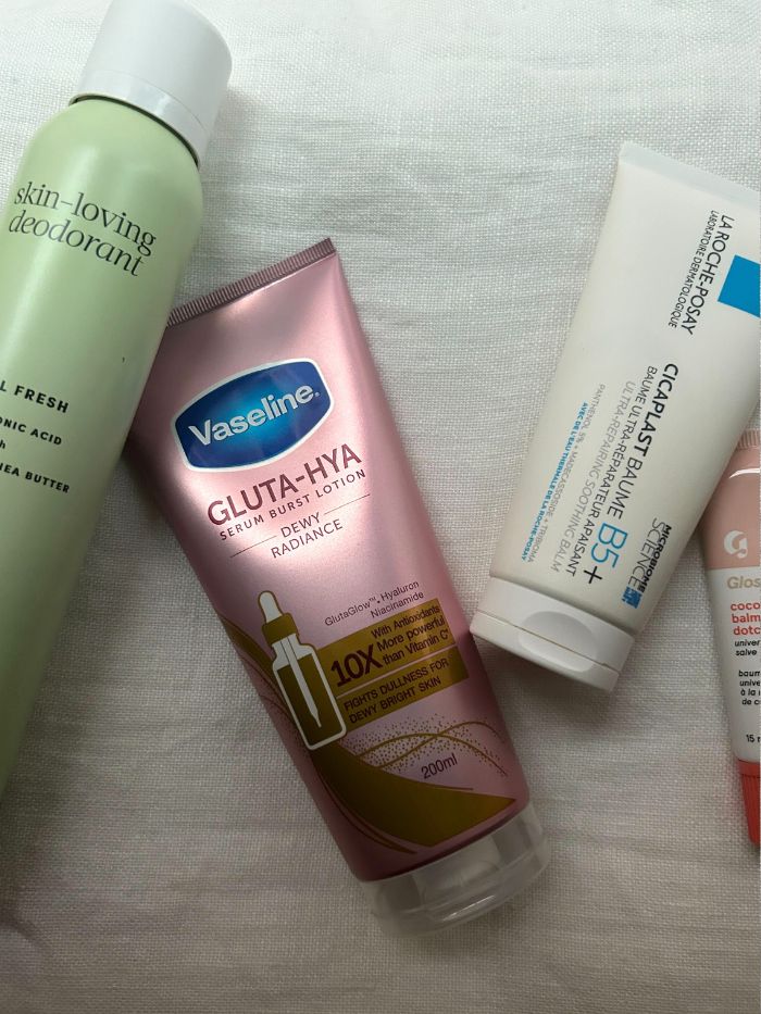 Affordable beauty products on a white linen background