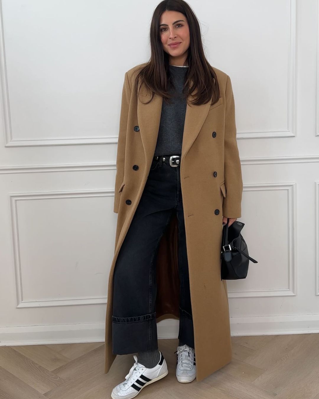 Influencer @wearetwinset wears Adidas Japan Trainers with jeans and a camel coat.
