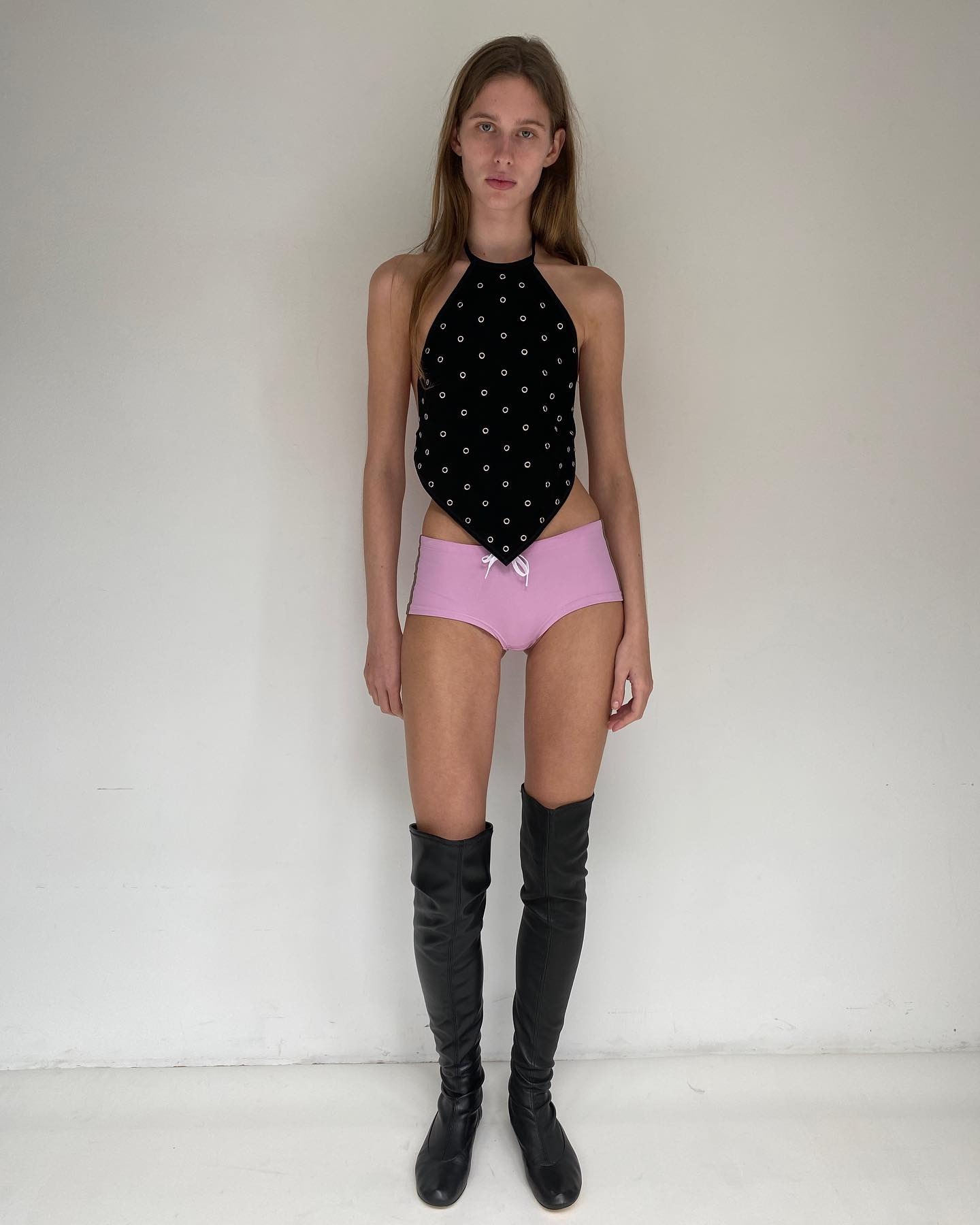 A model wearing a Gimaguas studded bandana top.