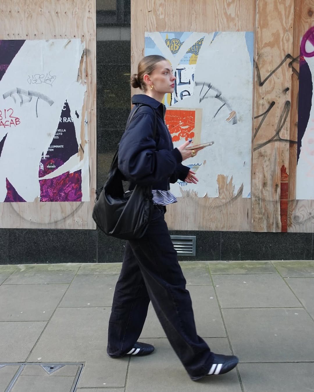An influencer wearing adidas sneakers.