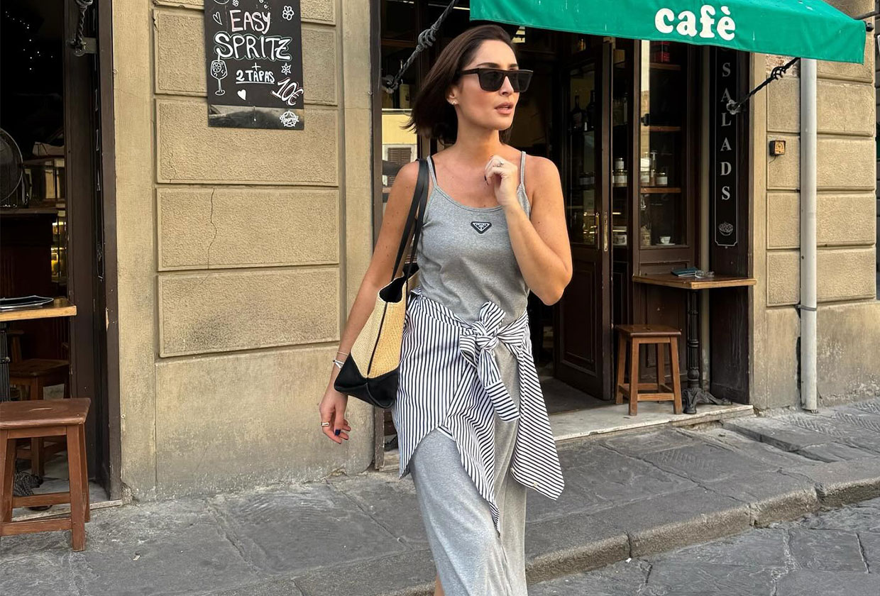 A French woman wearing a striped shirt around the waist