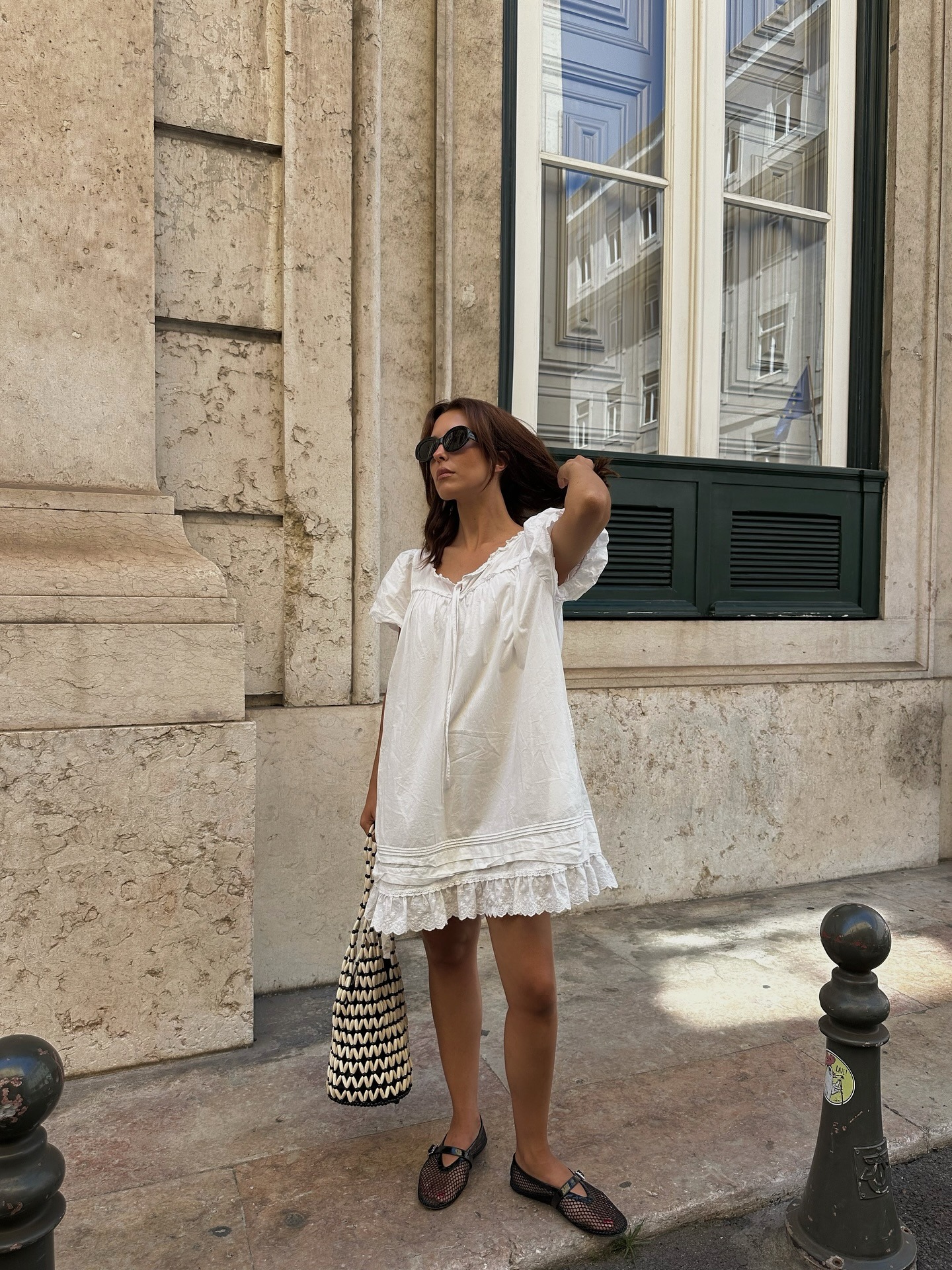 Stylist and fashion person Debora Rosa wears the swing mini dress trend in a recent image take from her Instagram.