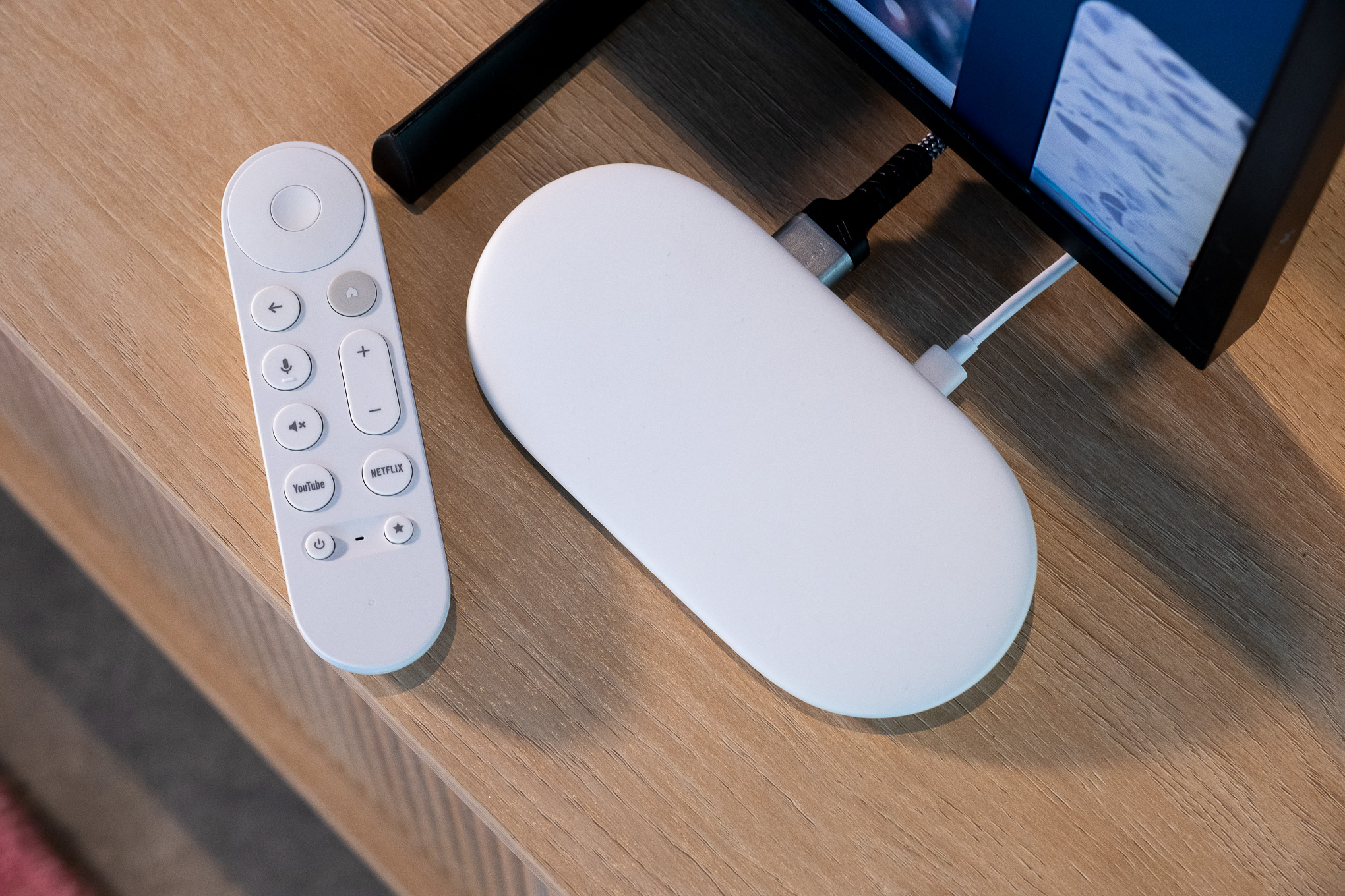 A hands-on photo of the Google TV Streamer set-top box.