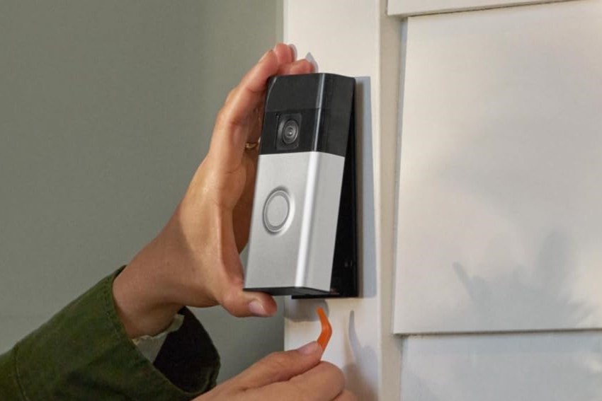 Someone installing Ring Video Doorbell 