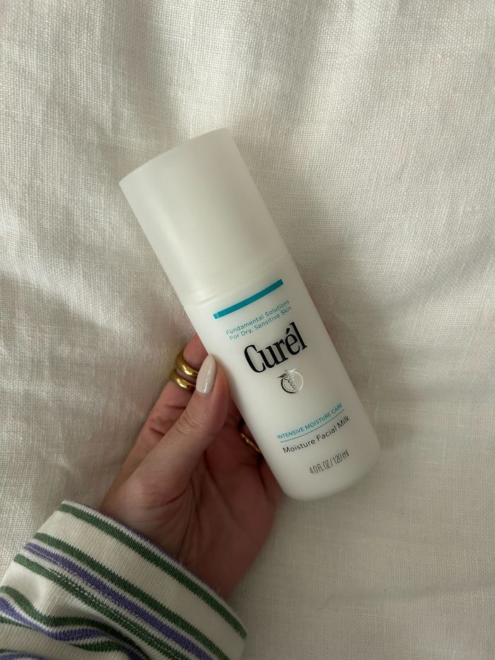 Junior beauty editor, Grace Lindsay, holding the Curel Moisture Facial Milk
