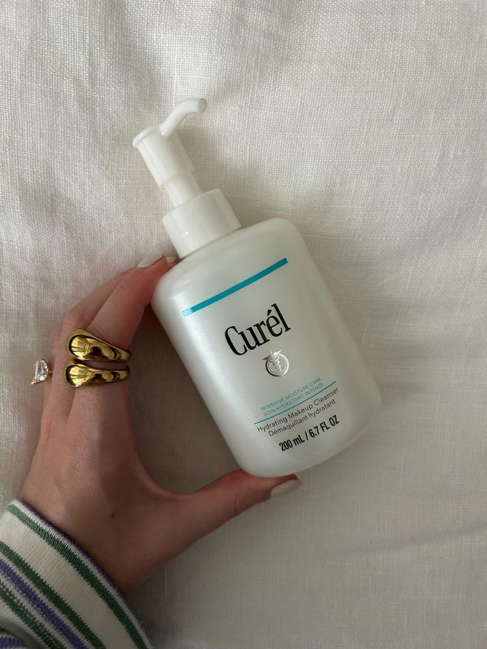 Junior beauty editor, Grace Lindsay, holding the Curel Hydrating Makeup Cleanser