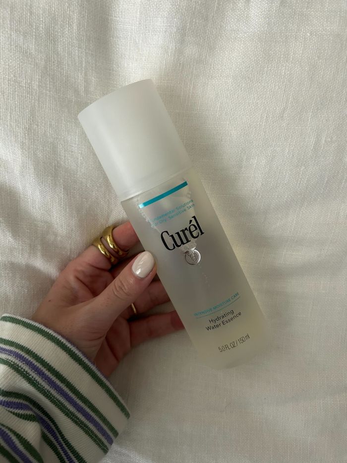 Junior beauty editor, Grace Lindsay, holding the Curel Hydrating Water Essence