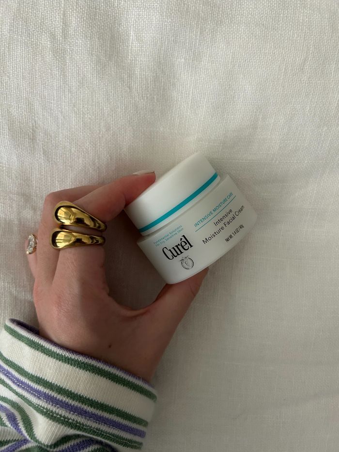 Junior beauty editor, Grace Lindsay, holding the Curel Intensive Moisture Facial Cream
