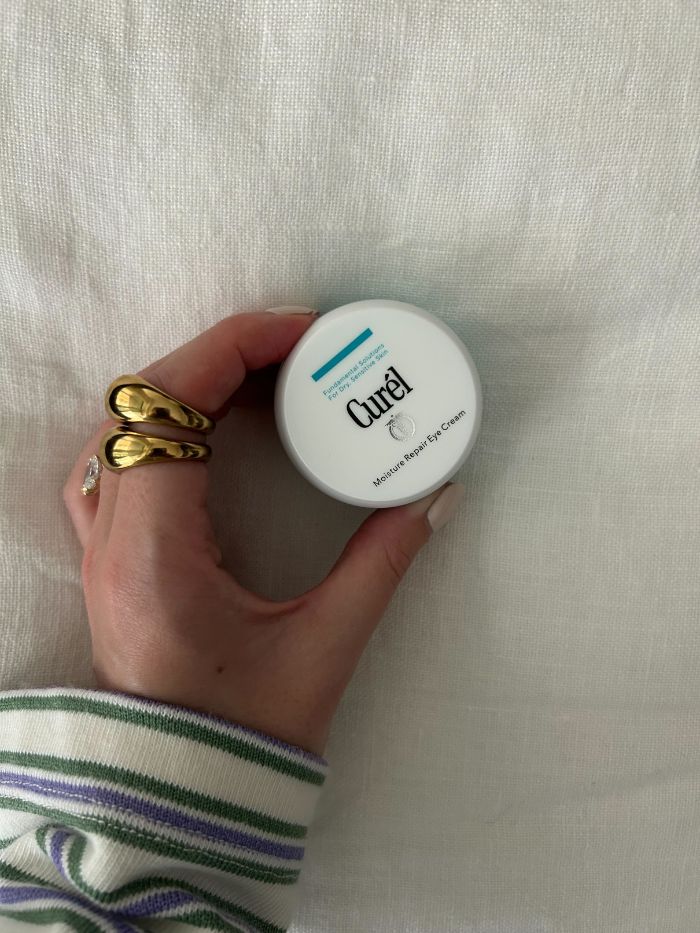 Junior beauty editor, Grace Lindsay, holding the Curel Moisture Repair Eye Cream