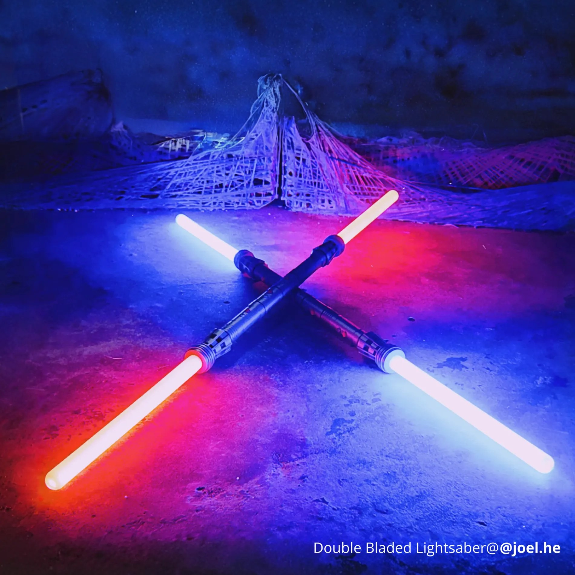 Two lightsabers on a purple and blue background