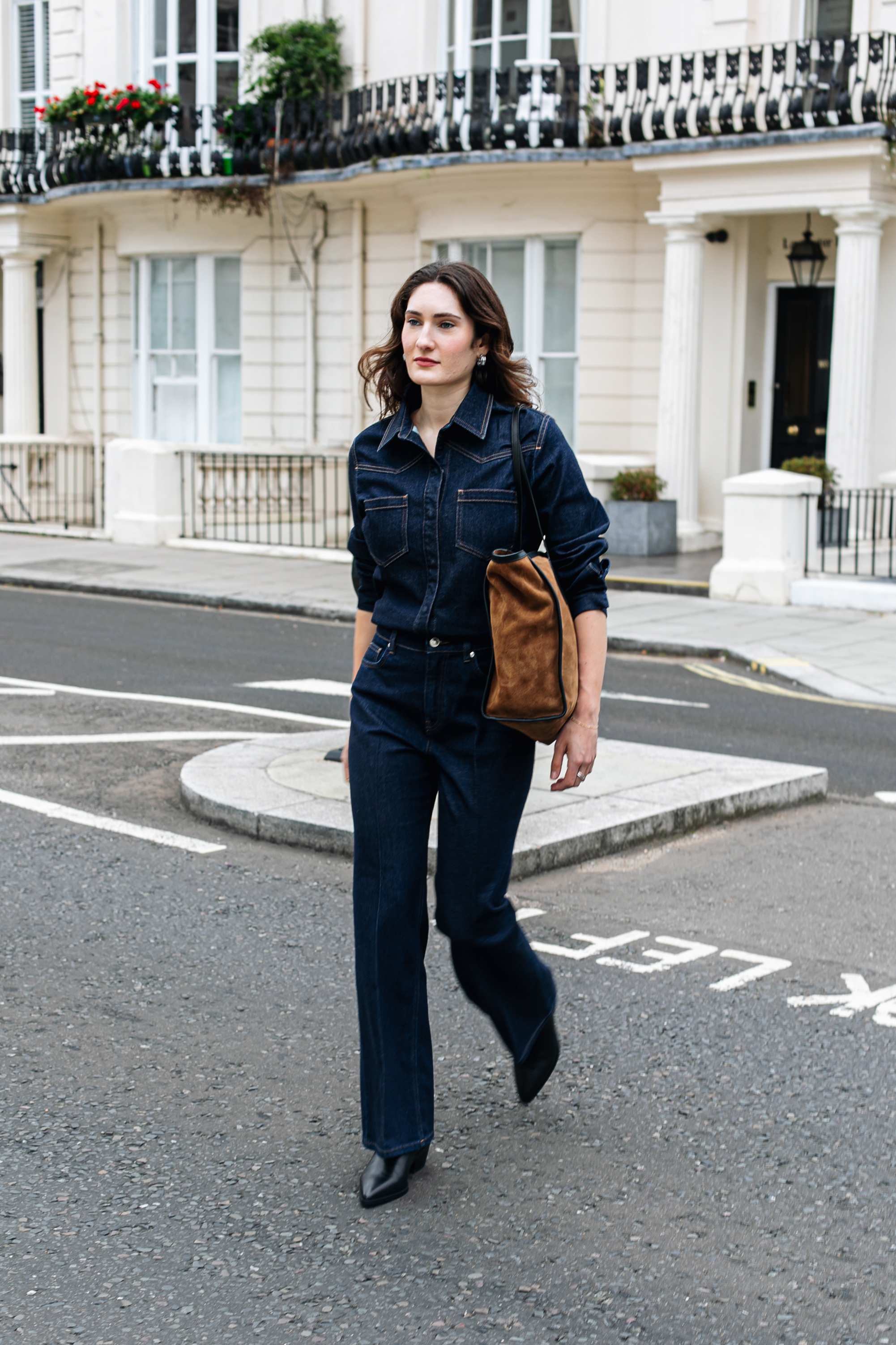 Who What Wear writer Natalie Munro wears flared jeans with pointed-toe boots.