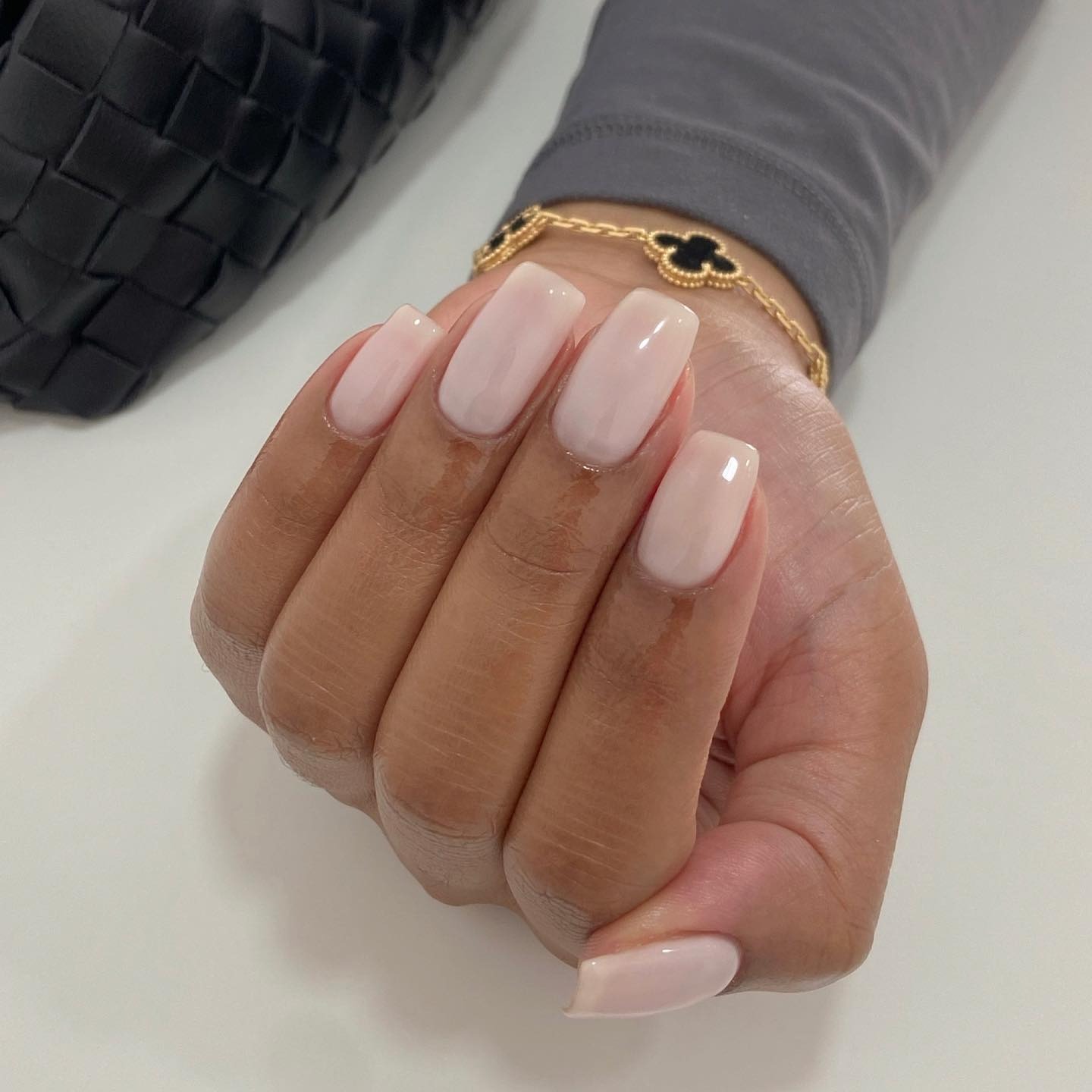 Long, square milky manicure with a shimmery finish