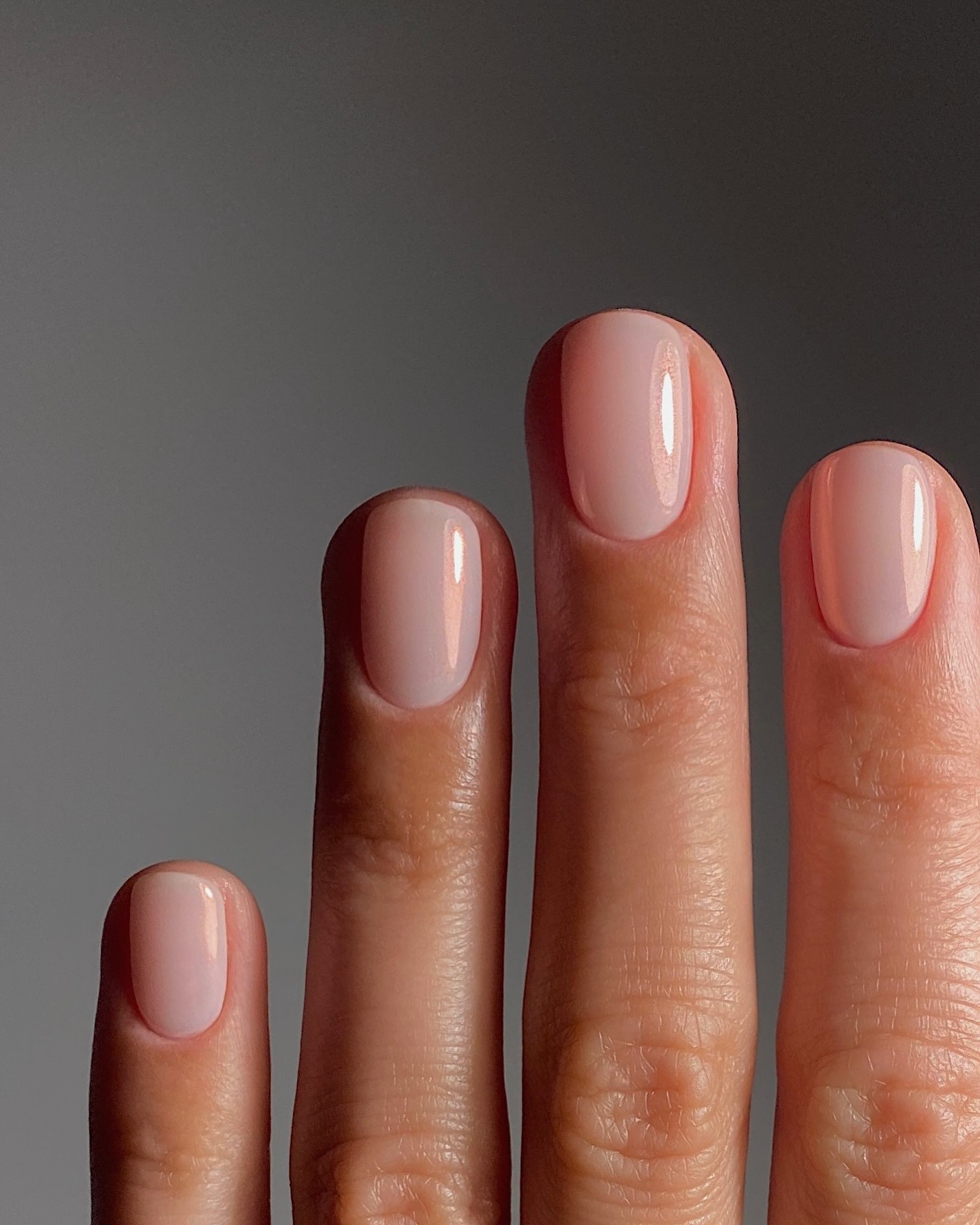 A short, rounded and shimmery manicure