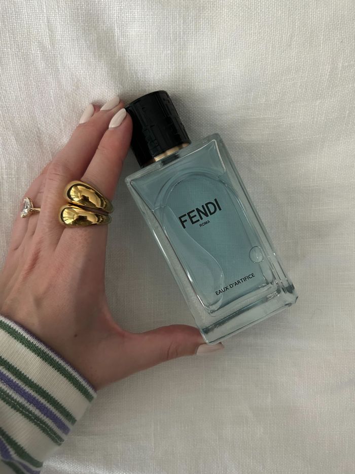 Junior beauty editor, Grace Lindsay, holding a Fendi perfume