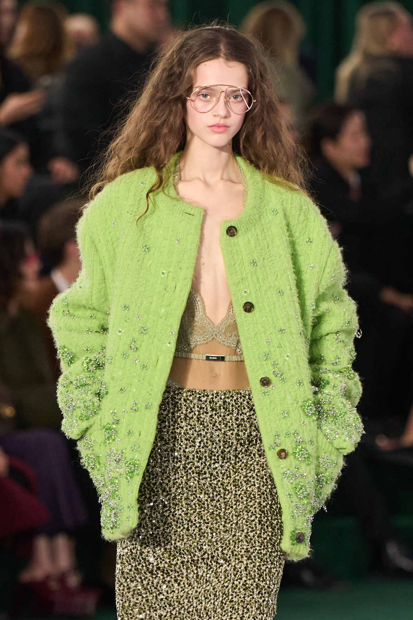 Model on a runway wearing knitwear